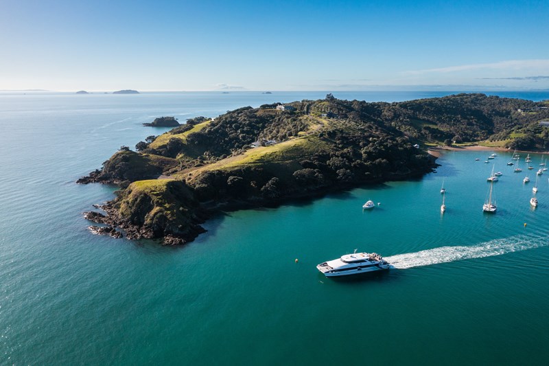 Waiheke Island harbour with ferry and sailboats